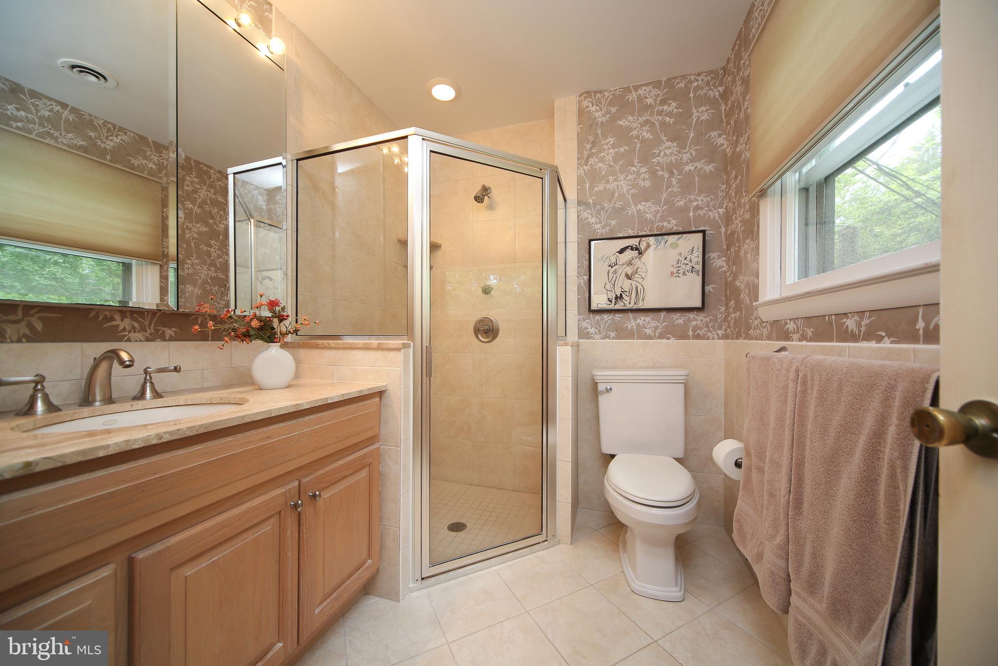 459 Wingate Road Huntingdon Valley, PA 19006 - Photo 25 of 31 a bathroom with a granite countertop sink toilet and shower