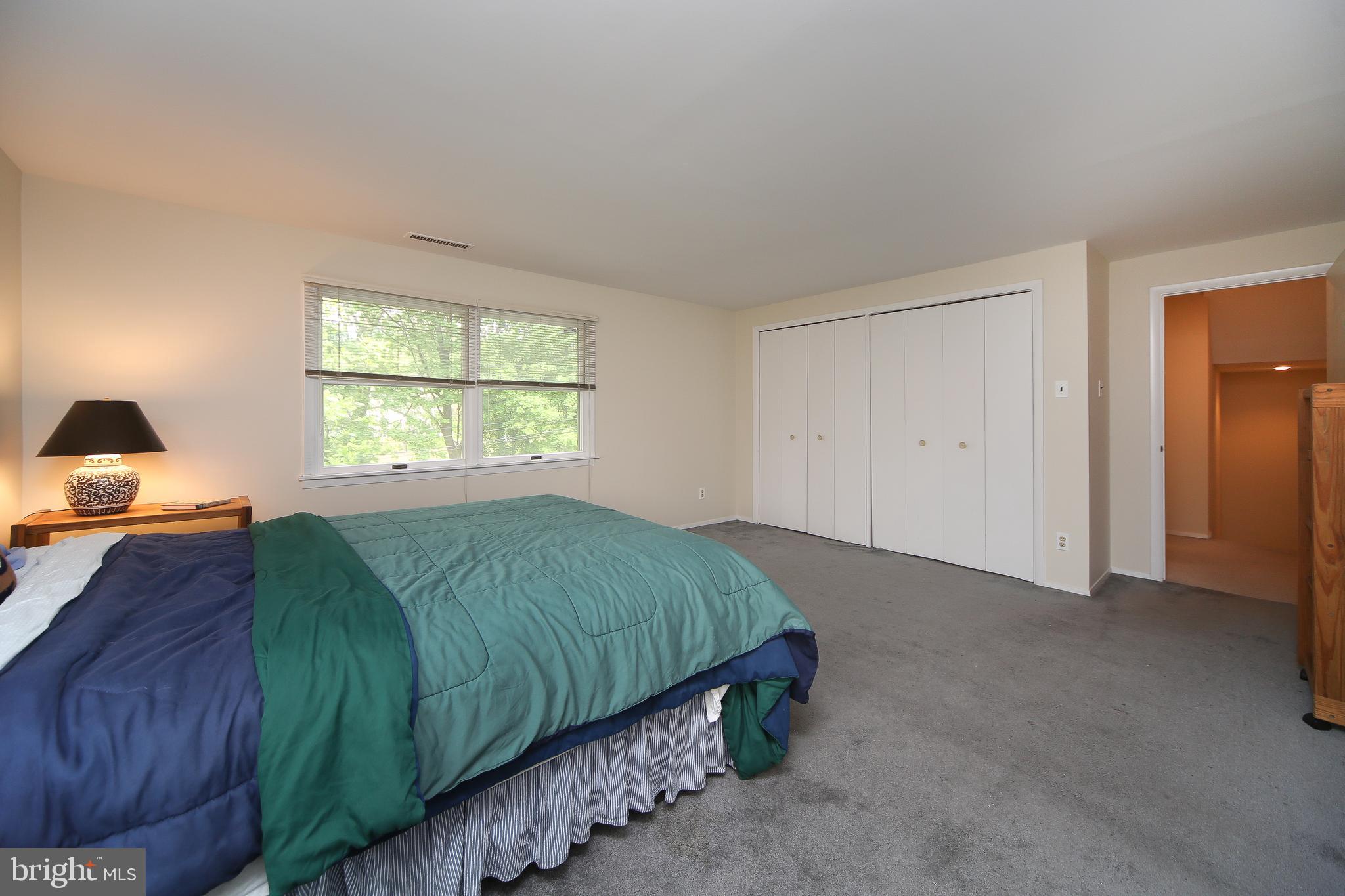 459 Wingate Road Huntingdon Valley, PA 19006 - Photo 27 of 31 a bedroom with a bed and a lamp on dresser