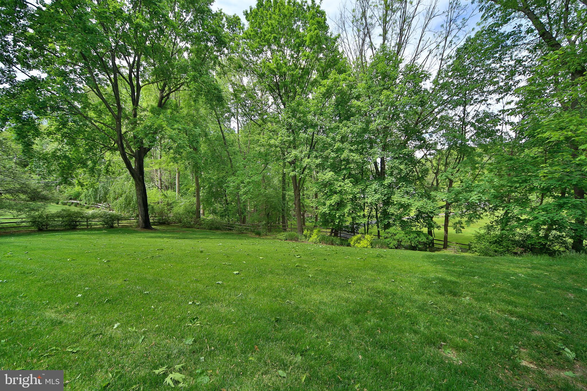 459 Wingate Road Huntingdon Valley, PA 19006 - Photo 31 of 31 a view of a grassy field with trees in the background