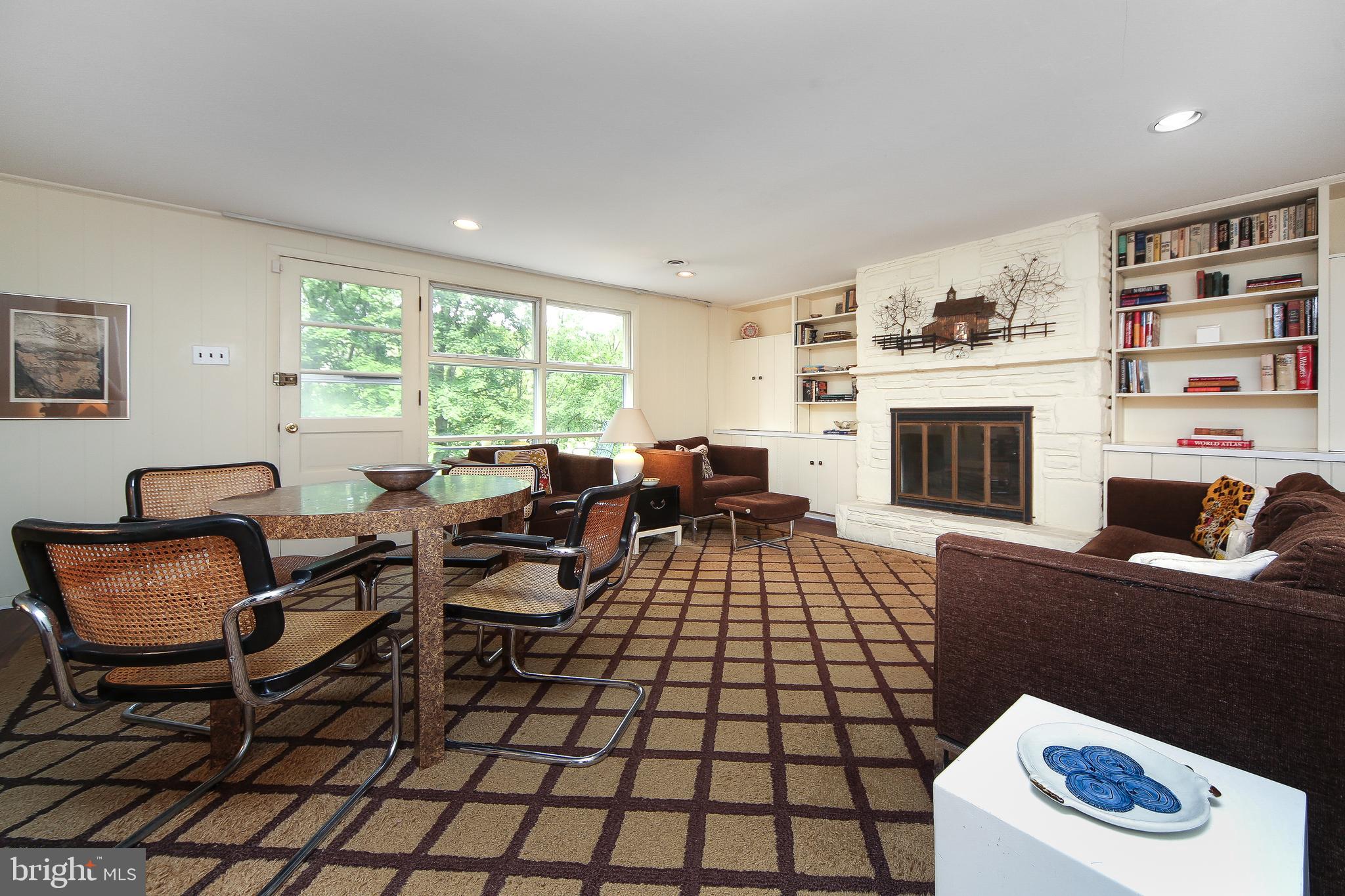 459 Wingate Road Huntingdon Valley, PA 19006 - Photo 8 of 31 a living room with furniture a flat screen tv and a fireplace