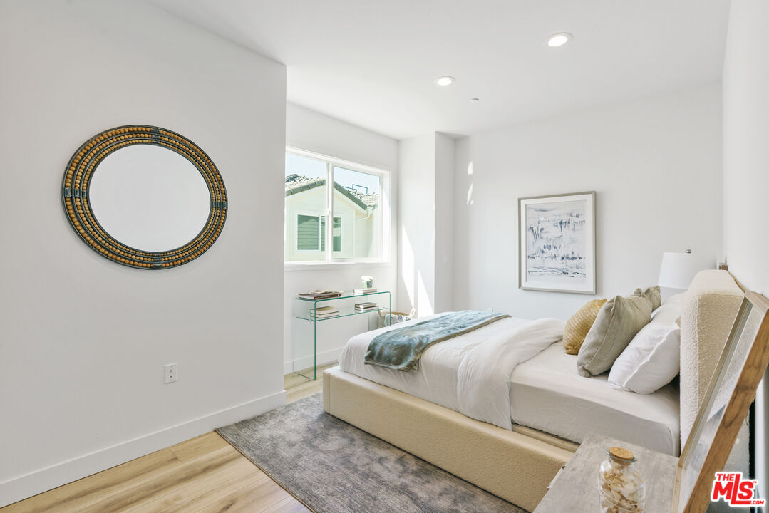 14652 West Sara Lane Panorama City, CA 91402 - Photo 15 of 33 a bedroom with a bed and a window