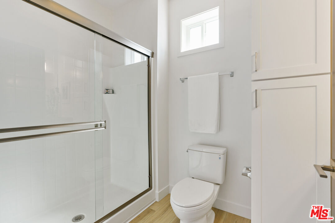 14652 West Sara Lane Panorama City, CA 91402 - Photo 18 of 33 a bathroom with a toilet and a shower