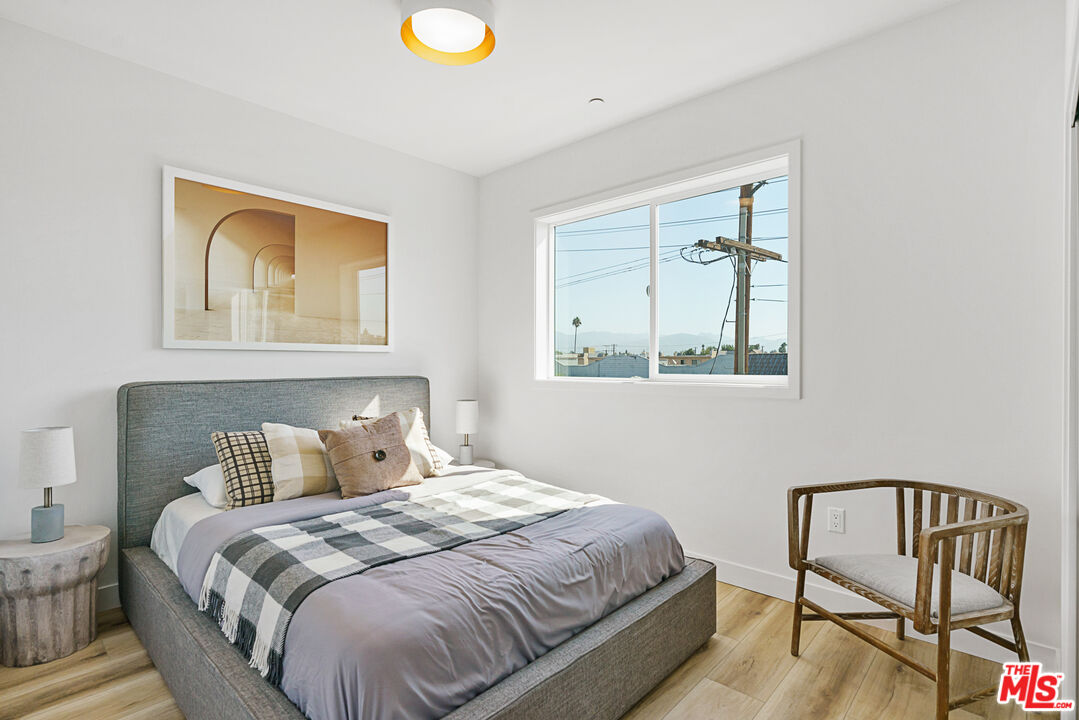 14652 West Sara Lane Panorama City, CA 91402 - Photo 20 of 33 a bedroom with a bed and chair