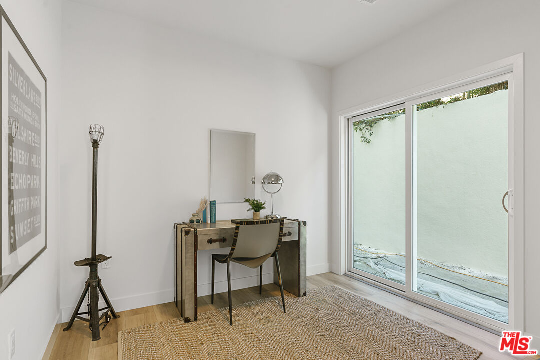 14652 West Sara Lane Panorama City, CA 91402 - Photo 27 of 33 a view of a workspace with furniture and a window