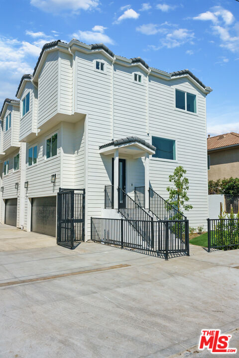 14652 West Sara Lane Panorama City, CA 91402 - Photo 5 of 33 a front view of a house with a garage