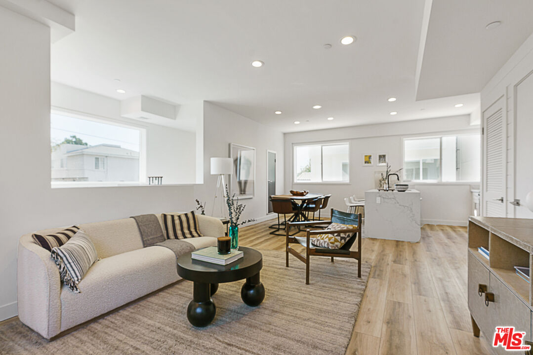 14652 West Sara Lane Panorama City, CA 91402 - Photo 6 of 33 a living room with furniture and a wooden floor