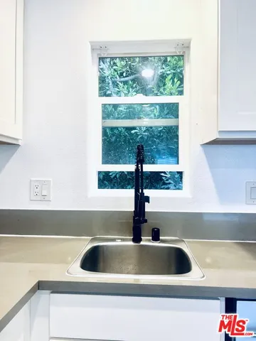 a kitchen with a sink and a window