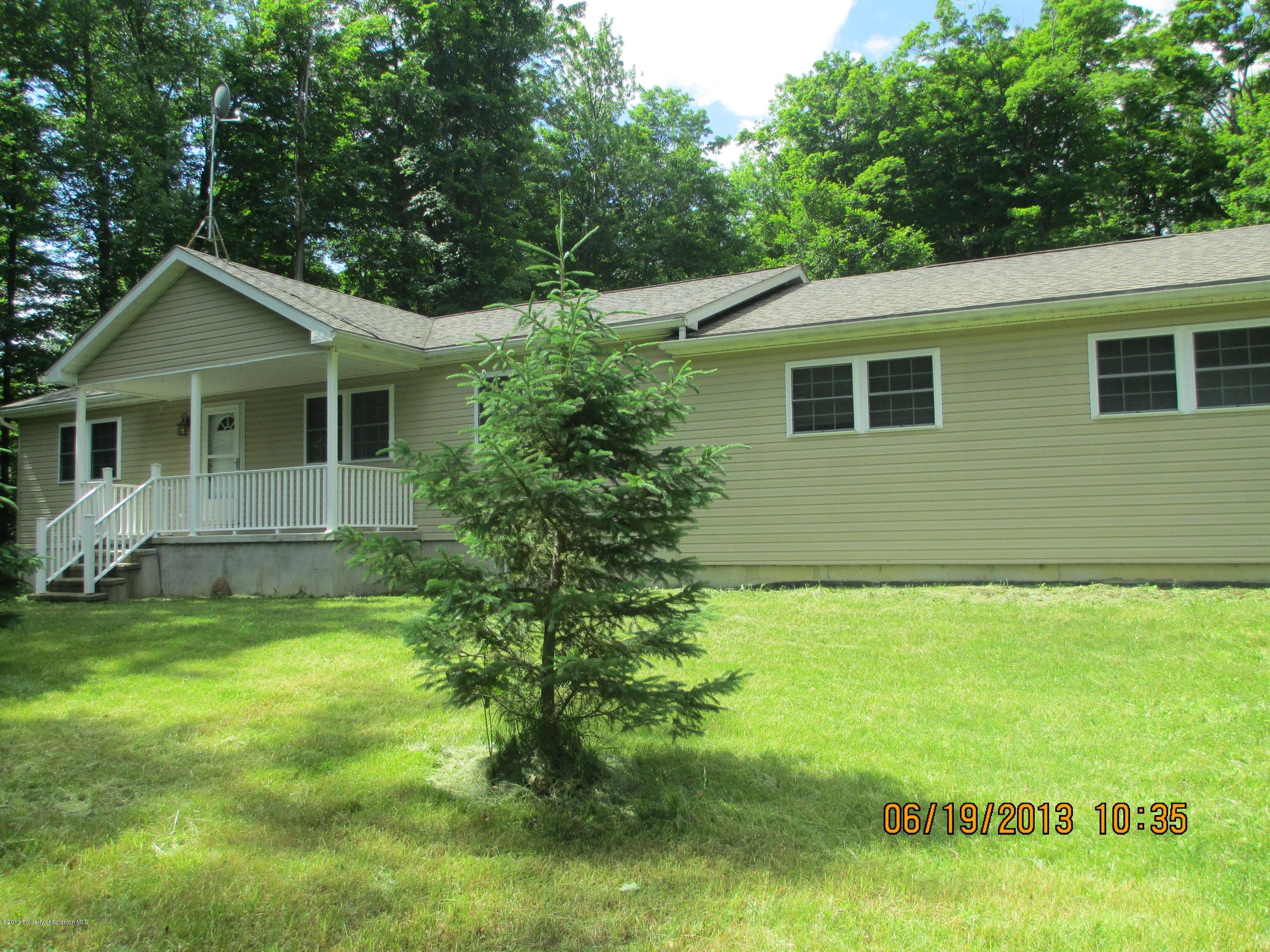 4270 Haas Pond Road Moscow, PA 18444 - Photo 1 of 15 a front view of a house with a yard