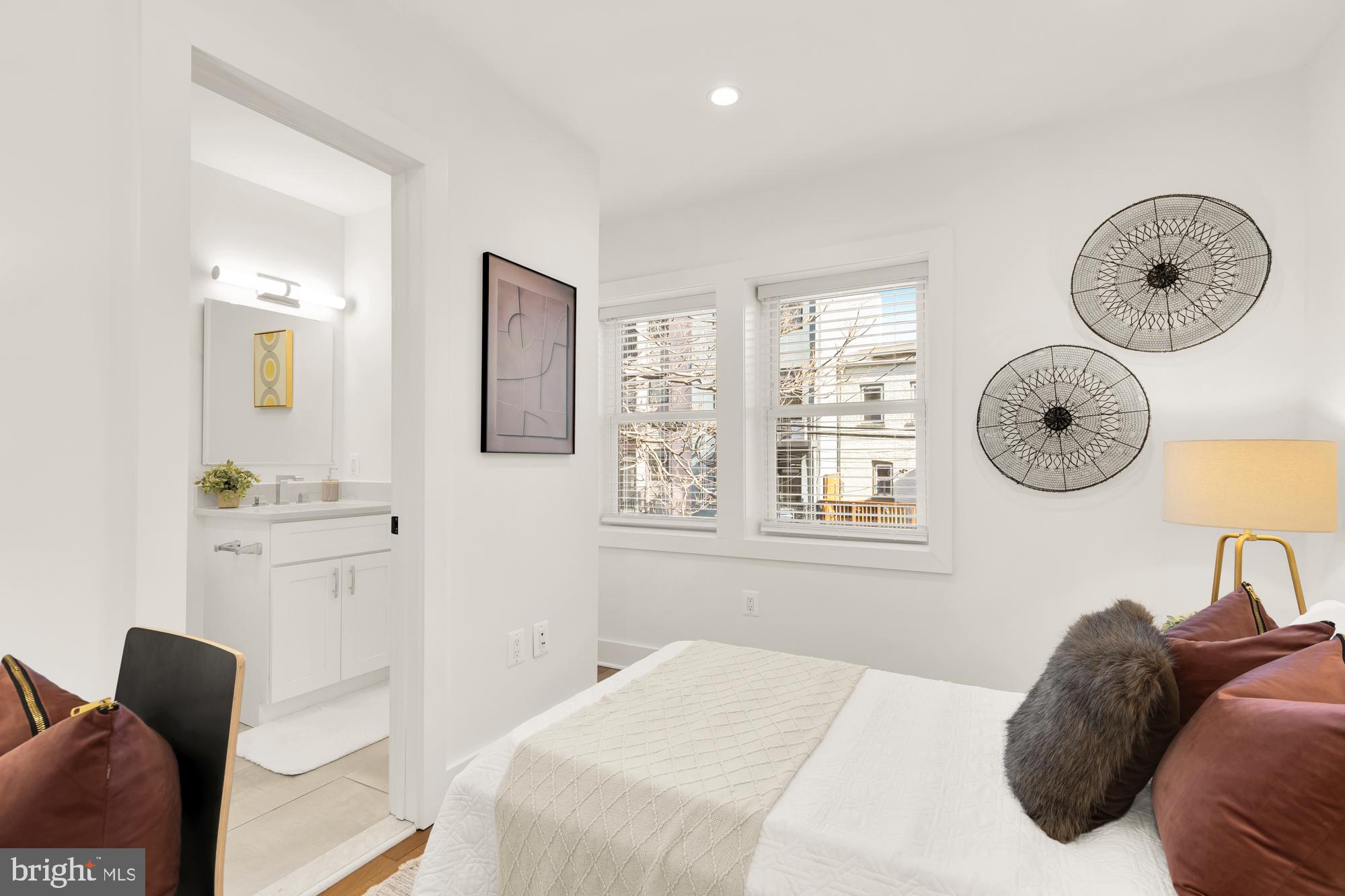 1171 3rd Street Northeast Washington, DC 20002 - Photo 13 of 27 a bedroom with a bed and dresser