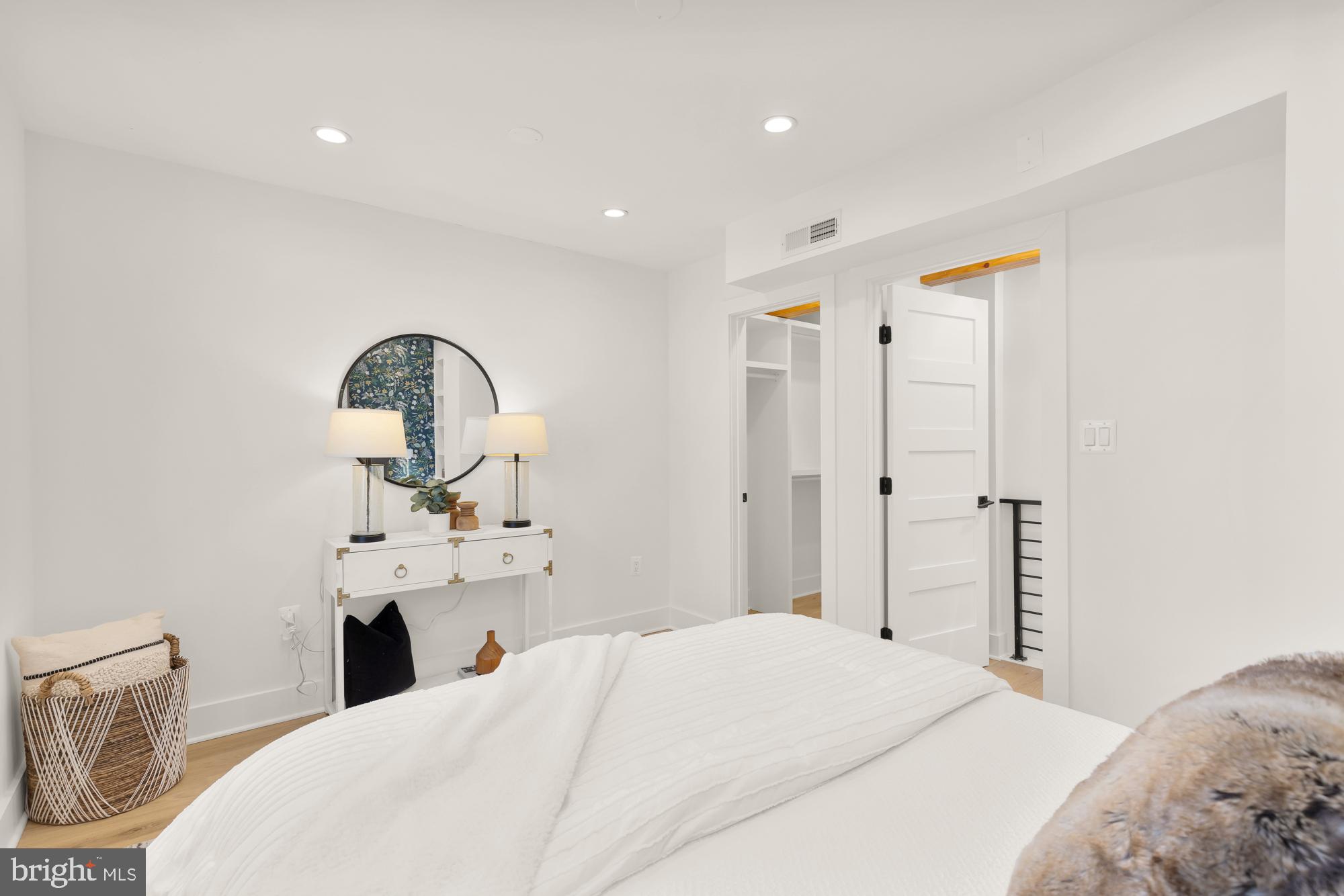 1171 3rd Street Northeast Washington, DC 20002 - Photo 22 of 27 a bedroom with a bed and a dresser
