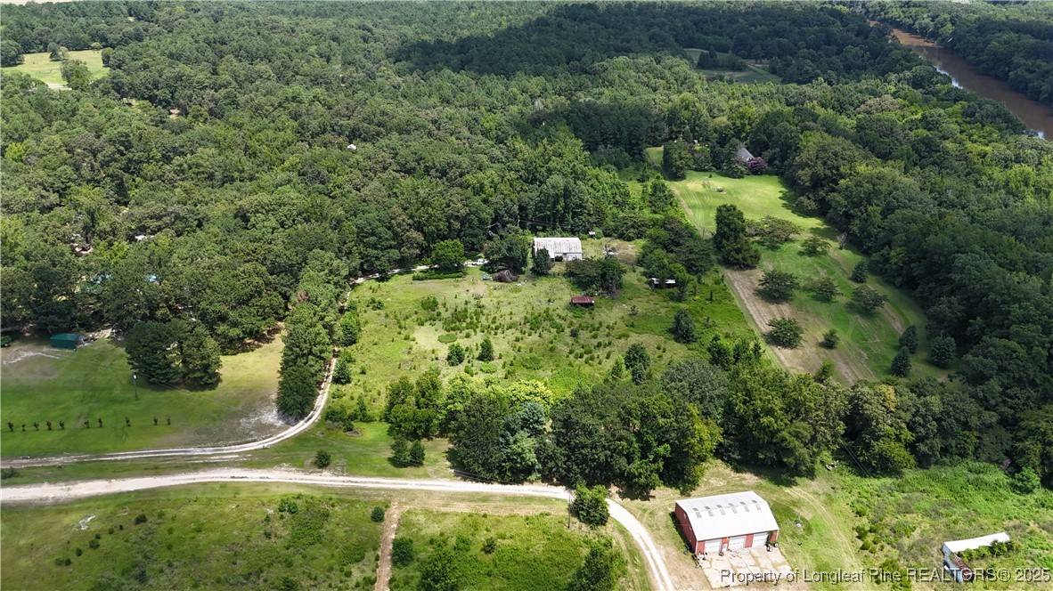 4199 Munsey Road Fayetteville, NC 28306 - Photo 2 of 24 an aerial view of residential house with outdoor space and trees all around