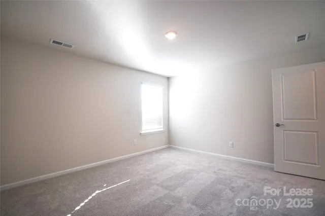 a bathroom with a double vanity sink toilet mirror and shower