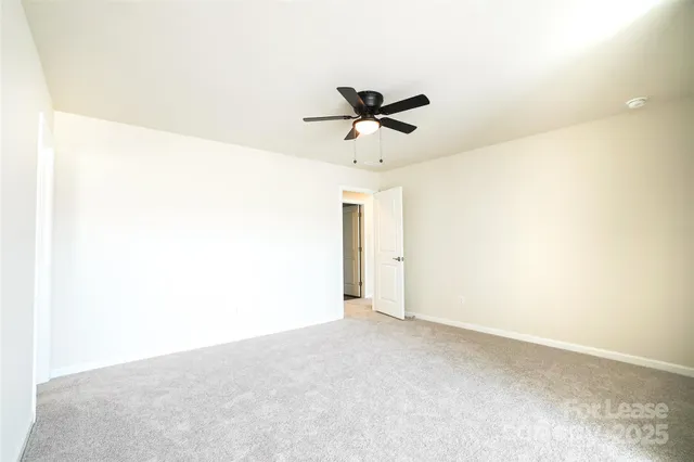 a white bath tub sitting next to a white toilet