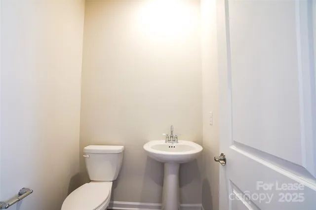 a bathroom with double sink and a mirror