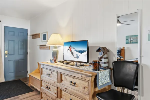 a room with furniture and a dresser
