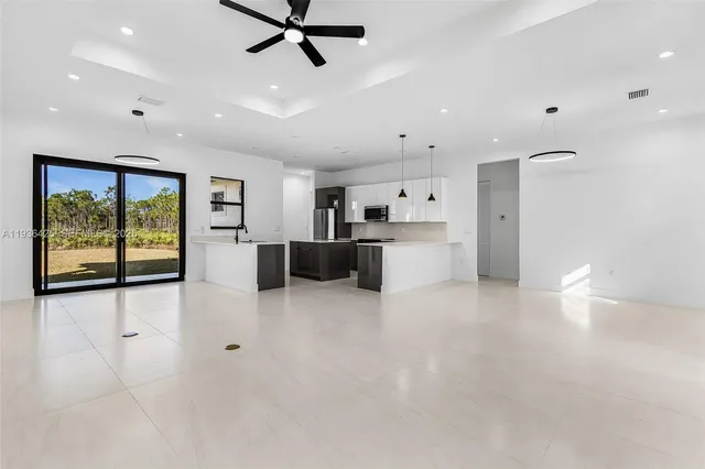 a view of a kitchen with a stove and a window