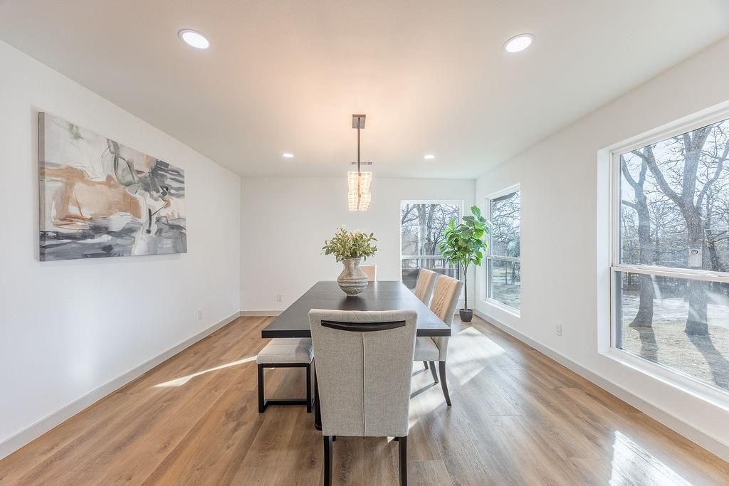 8713 Clay Hibbins Road Keller, TX 76248 - Photo 32 of 40 a dining room with furniture and wooden floor