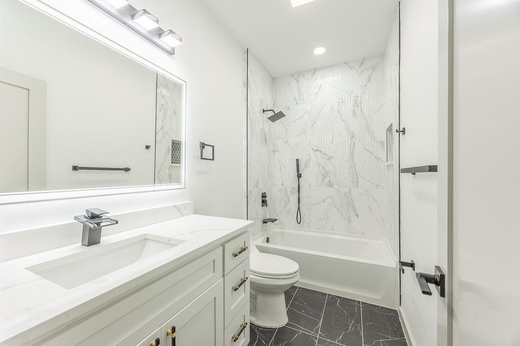 8713 Clay Hibbins Road Keller, TX 76248 - Photo 34 of 40 a bathroom with a sink toilet tub and shower