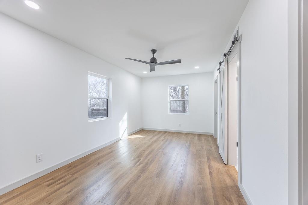 8713 Clay Hibbins Road Keller, TX 76248 - Photo 36 of 40 wooden floor in an empty room with a window