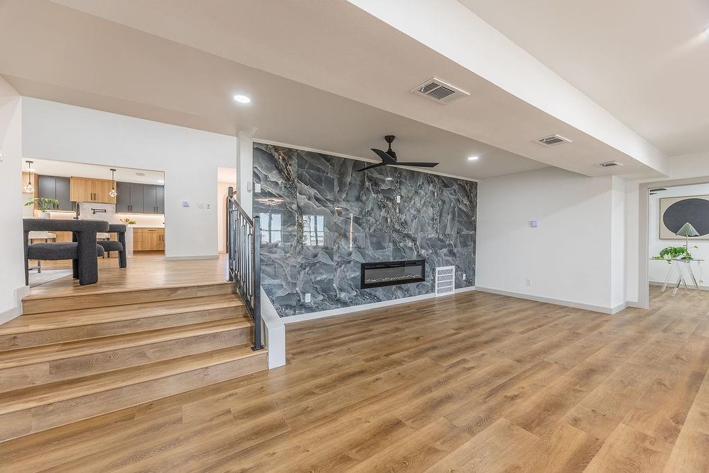 8713 Clay Hibbins Road Keller, TX 76248 - Photo 38 of 40 a view of empty room with wooden floor and fireplace