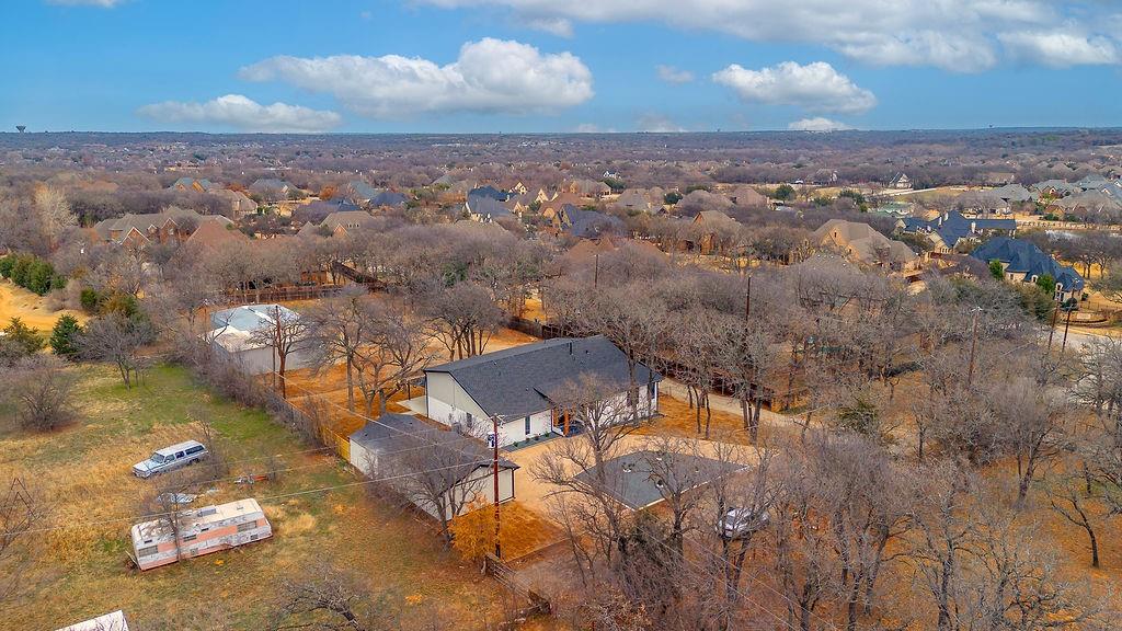 8713 Clay Hibbins Road Keller, TX 76248 - Photo 7 of 40 an aerial view of a house with a yard and lake view