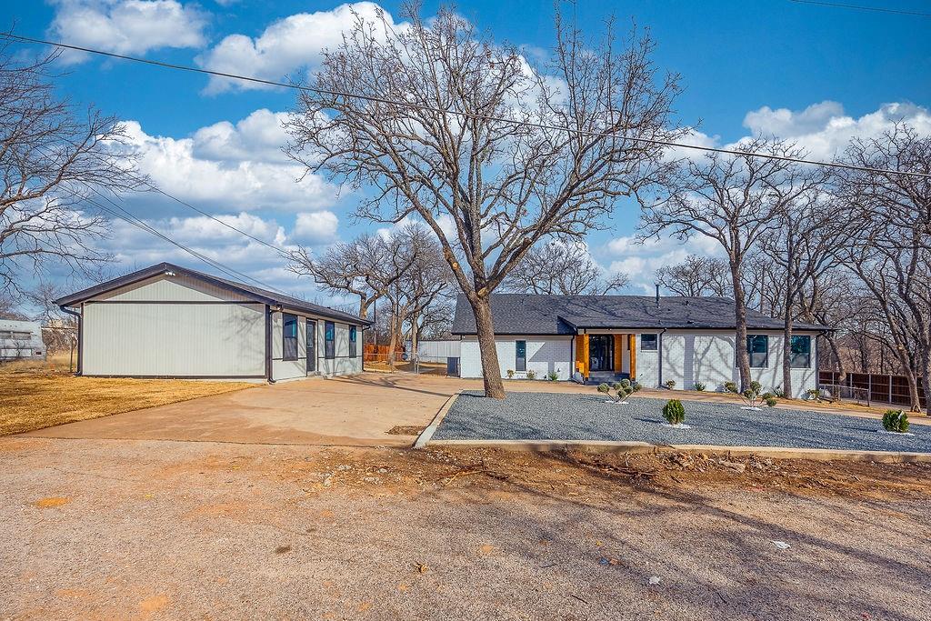 8713 Clay Hibbins Road Keller, TX 76248 - Photo 8 of 40 a front view of a house with a yard