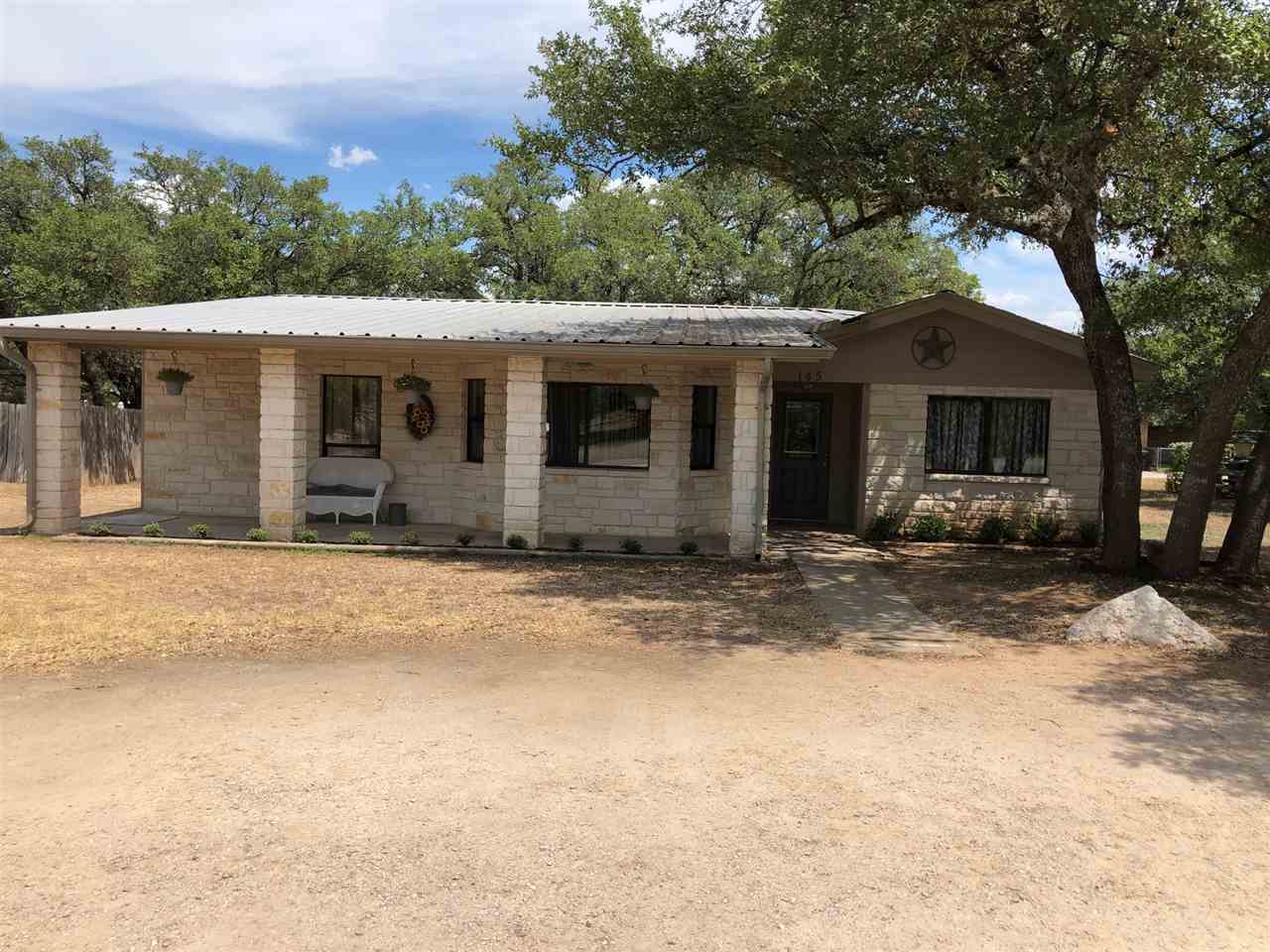 a backyard of a house with yard and garage