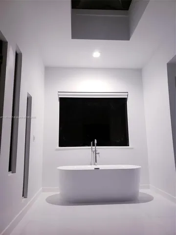 a room with furniture and a flat screen tv