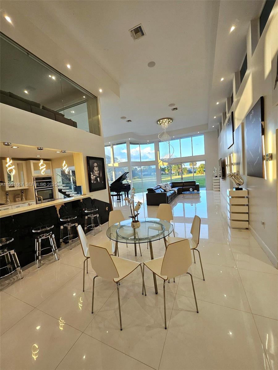 6003 Umbrella Tree Lane Tamarac, FL 33319 - Photo 20 of 22 a view of a dining room with furniture