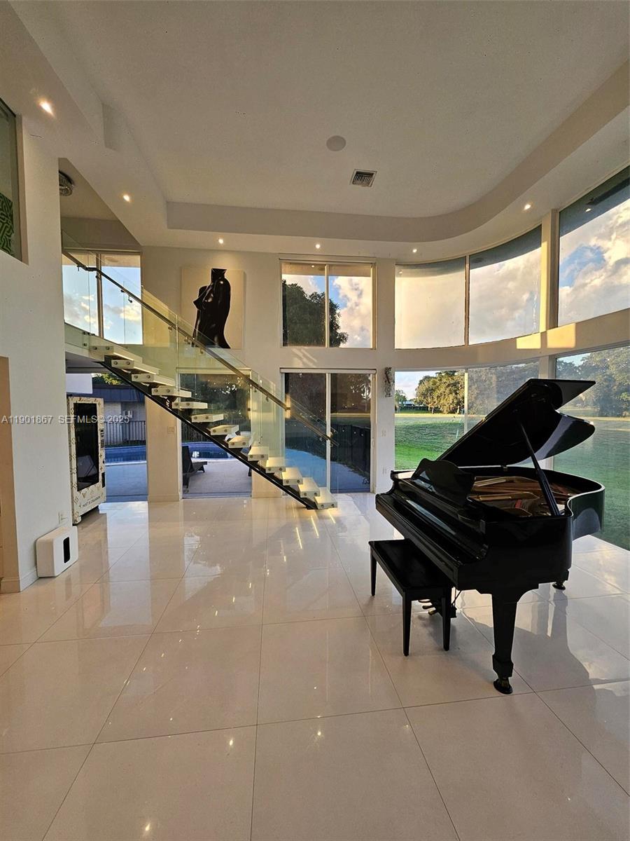 6003 Umbrella Tree Lane Tamarac, FL 33319 - Photo 22 of 22 a living room with furniture and a piano