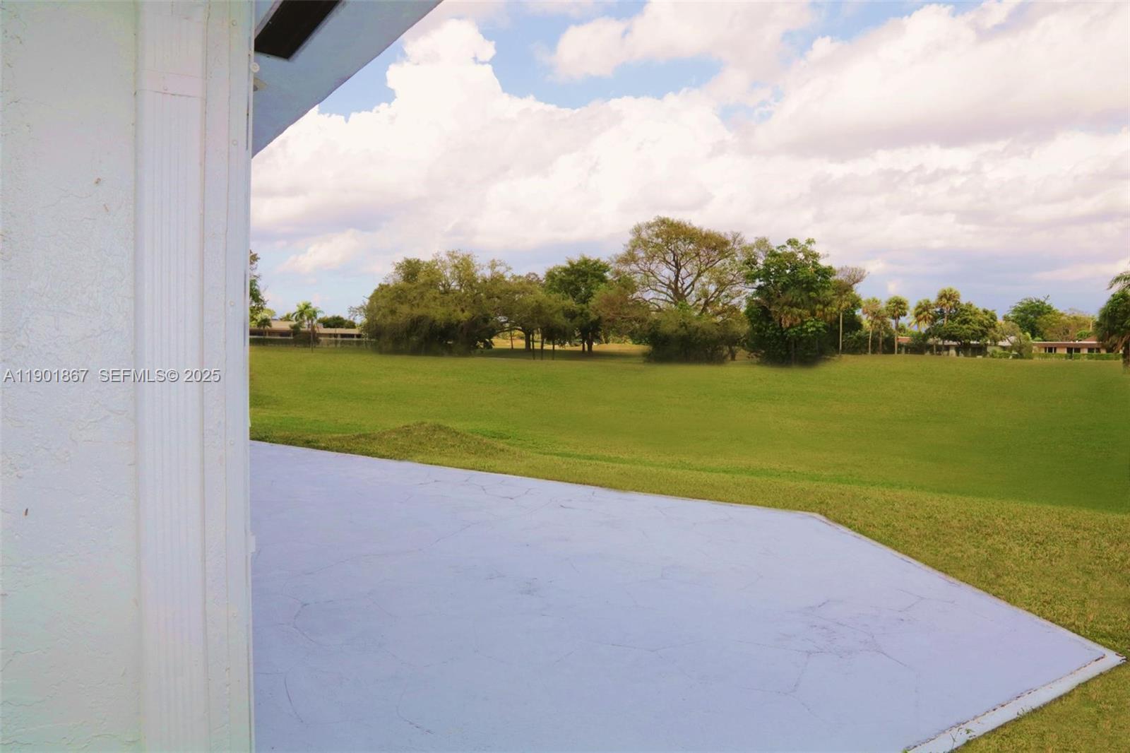 6003 Umbrella Tree Lane Tamarac, FL 33319 - Photo 5 of 22 a view of a field with a big yard