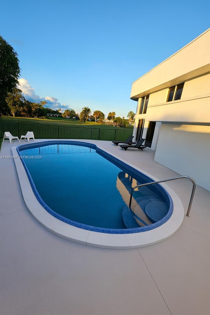6003 Umbrella Tree Lane Tamarac, FL 33319 - Photo 6 of 22 a view of swimming pool from a balcony