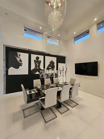 a living room with furniture a rug and a flat screen tv