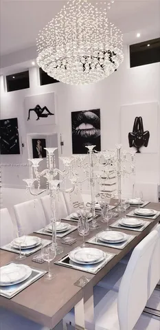 a kitchen with a table and chairs