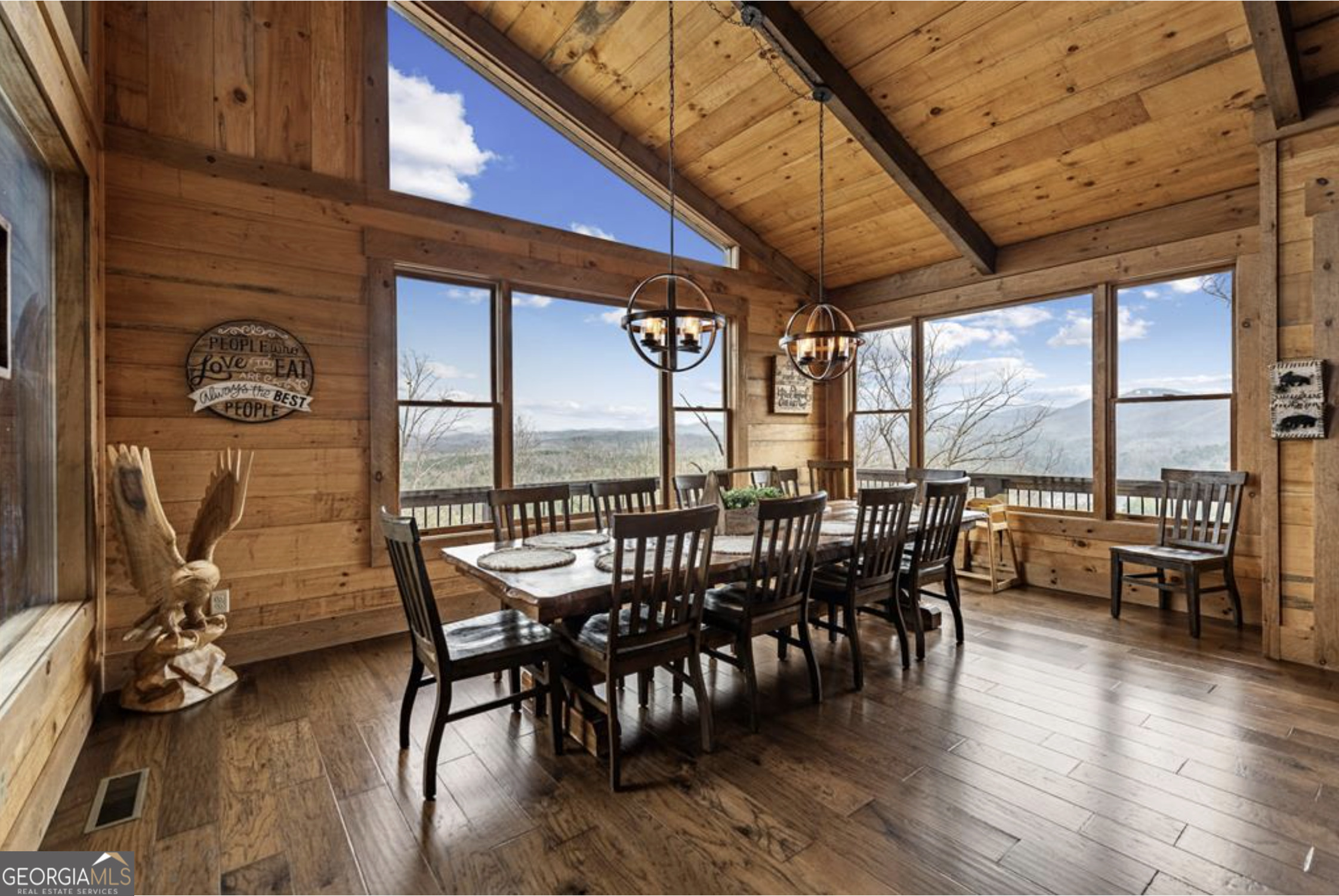 585 Genessee Path Blue Ridge, GA 30513 - Photo 22 of 66 a view of a dining room with furniture window and wooden floor