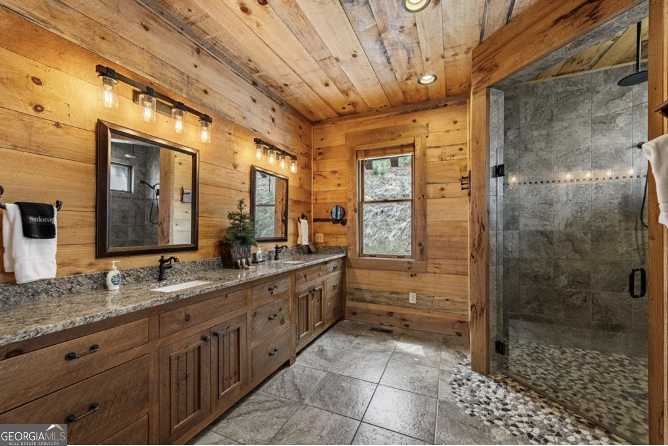 585 Genessee Path Blue Ridge, GA 30513 - Photo 28 of 66 a bathroom with a granite countertop sink a toilet and shower