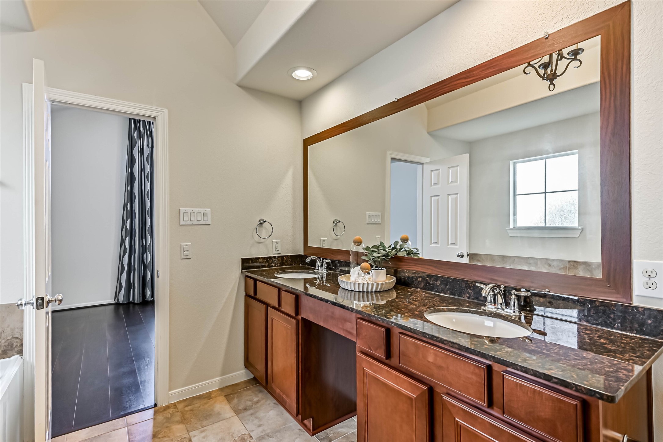 3208 Clearview Circle Houston, TX 77025 - Photo 19 of 30 a bathroom with a granite countertop sink and a mirror