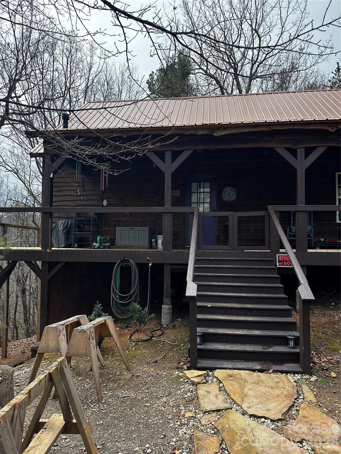 1897 Casper Hawkins Road Ferguson, NC 28624 - Photo 2 of 2 a front view of a house with stairs yard