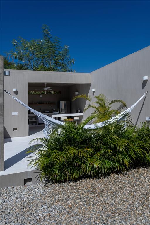 1 Casa Sana Mexico, OUTSIDE OF THE US 70934 - Photo 6 of 36 a backyard of a house with a garden and plants