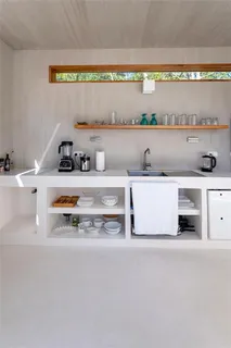 a kitchen with stainless steel appliances granite countertop a sink and a stove