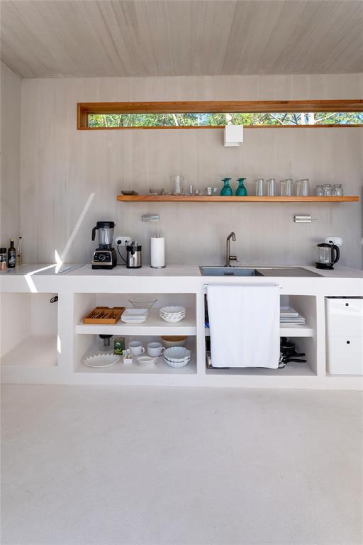 1 Casa Sana Mexico, OUTSIDE OF THE US 70934 - Photo 9 of 36 a kitchen with a sink a stove and cabinets
