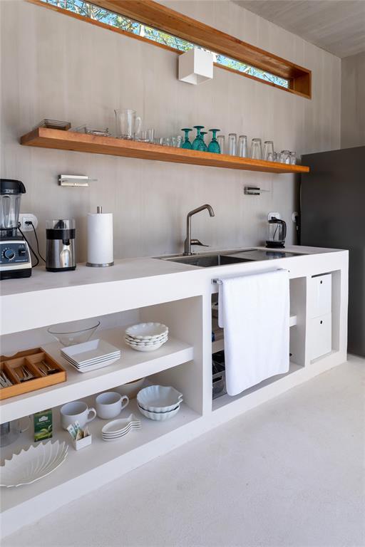 1 Casa Sana Mexico, OUTSIDE OF THE US 70934 - Photo 10 of 36 a kitchen with stainless steel appliances granite countertop a sink and a stove