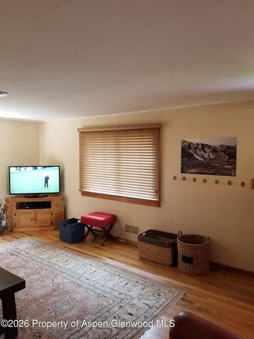 a view of a workspace with furniture and a gate