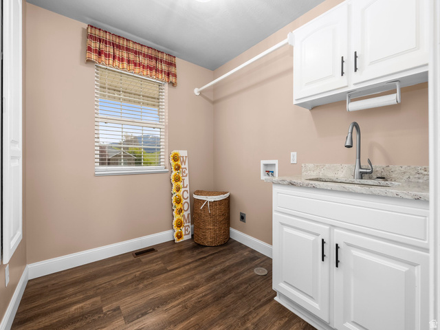 6849 North Black Powder Road Mountain Green, UT 84050 - Photo 21 of 43 Utility area featuring wood-finish flooring, a single window with blinds, white cabinetry, a light-toned countertop, and a stainless steel sink with a gooseneck faucet