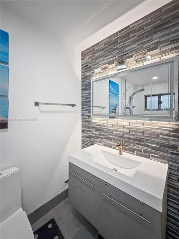 a bathroom with a sink and a toilet