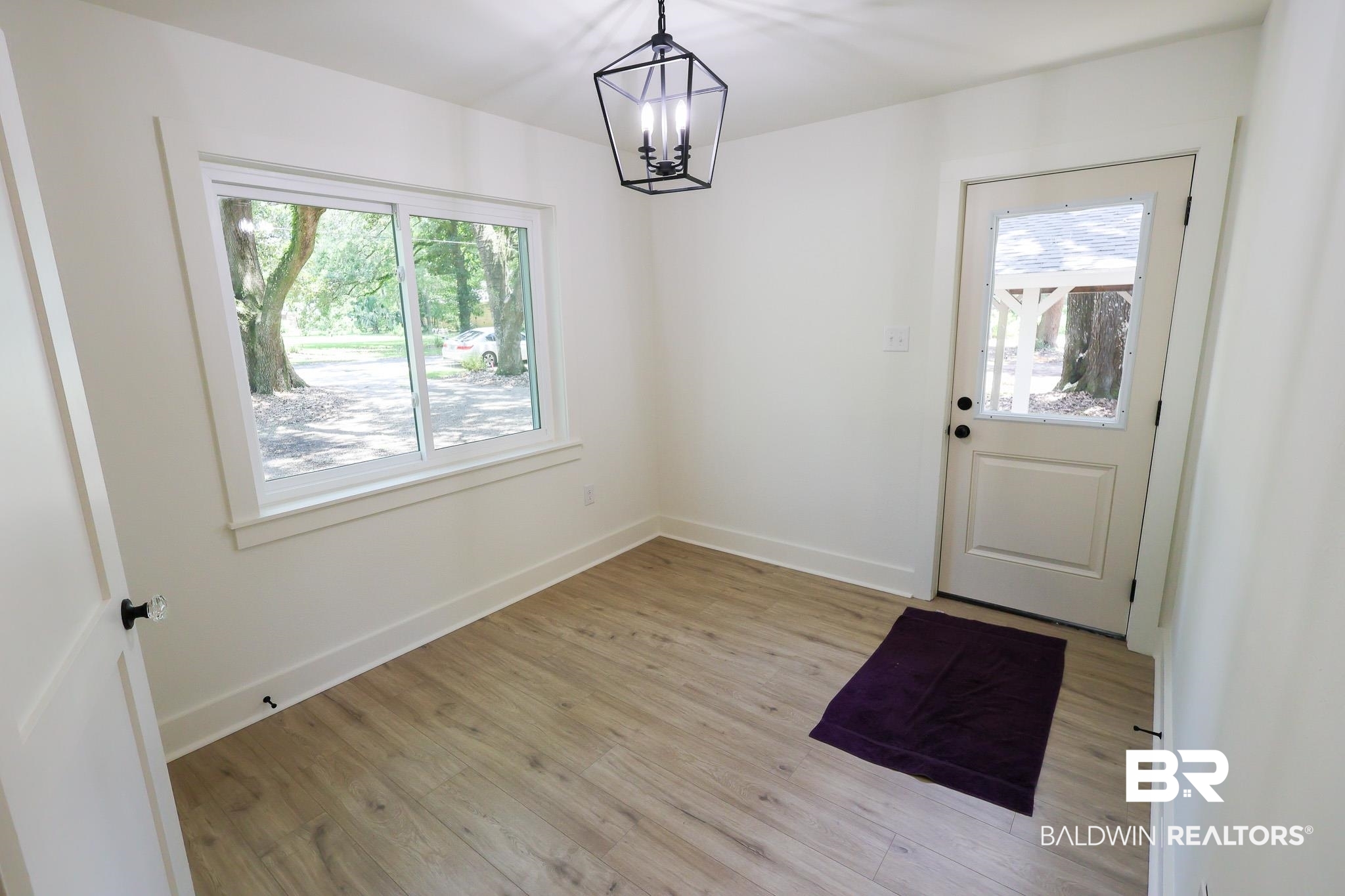 12190 Pecan Grove Street Magnolia Springs, AL 36555 - Photo 2 of 45 Entryway featuring a chandelier and light hardwood / wood-style floors