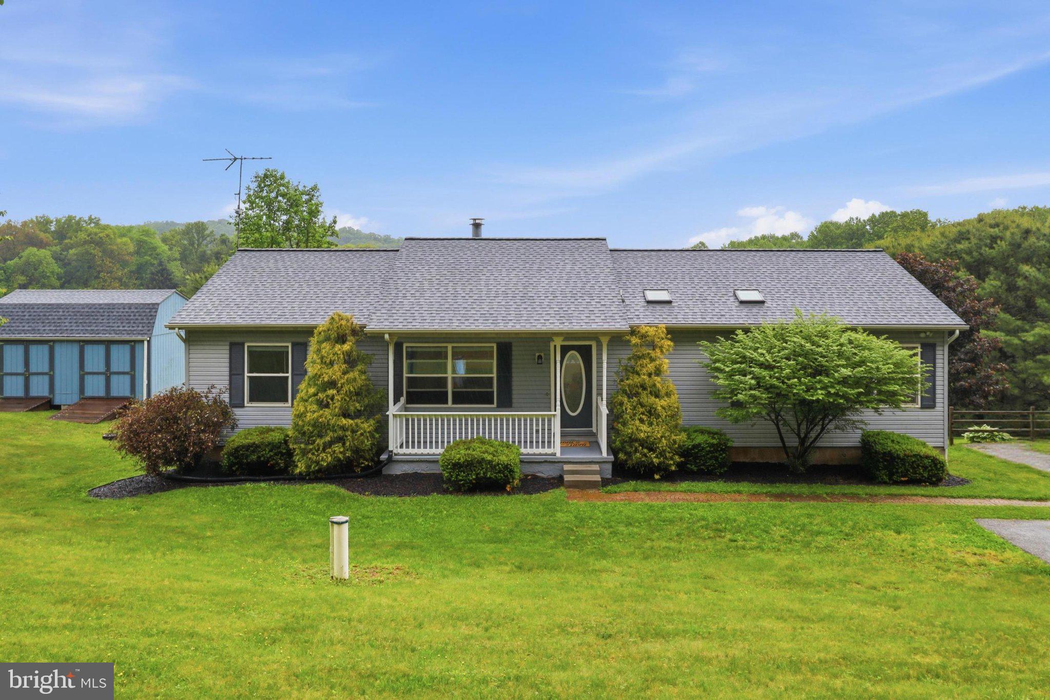 491 Garvine Mill Road Fawn Grove, PA 17321 - Photo 2 of 47 a view of a house with a garden