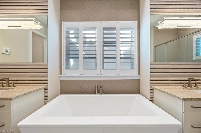 a bathroom with a bathtub and a sink