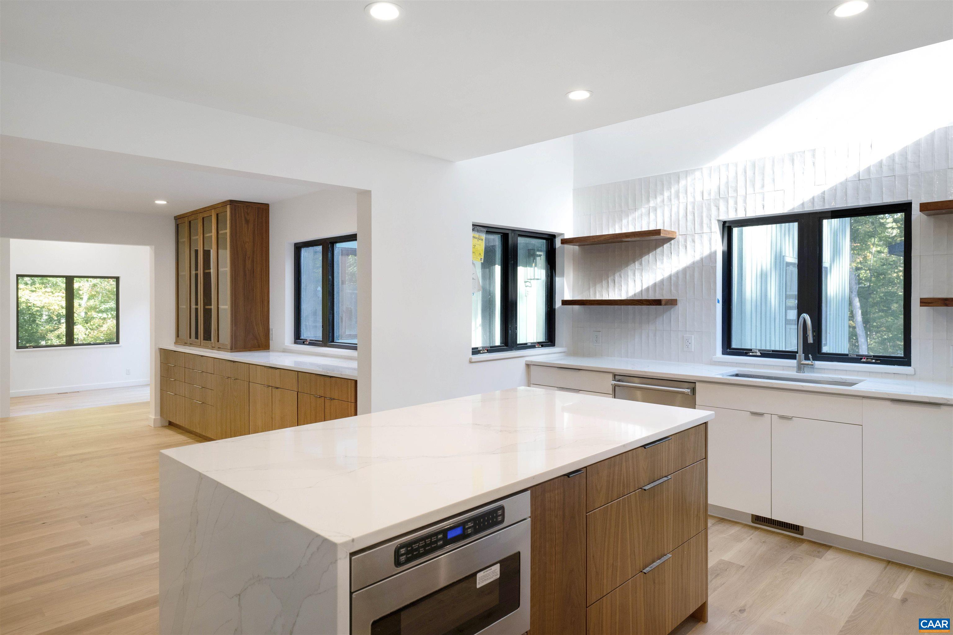 2482 Schelford Farm Road Charlottesville, VA 22901 - Photo 12 of 39 a kitchen with a stove and a sink