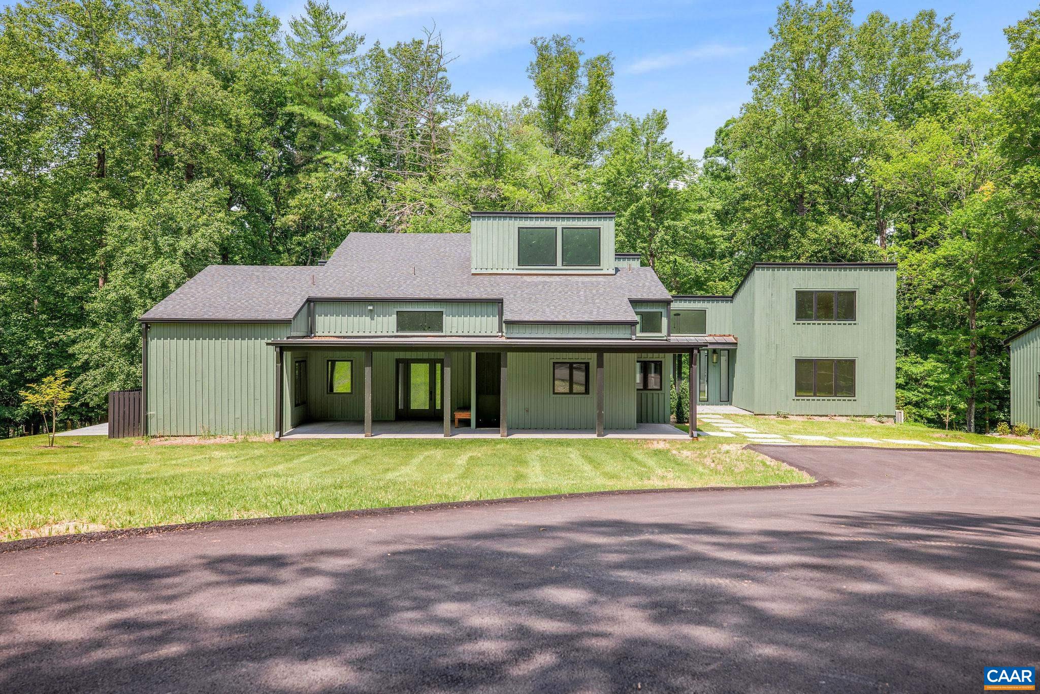2482 Schelford Farm Road Charlottesville, VA 22901 - Photo 18 of 39 a front view of a house with a yard and garage